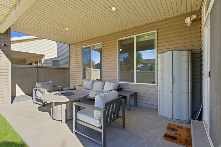Covered patio featuring recessed lighting, durable concrete flooring, and vinyl siding exterior