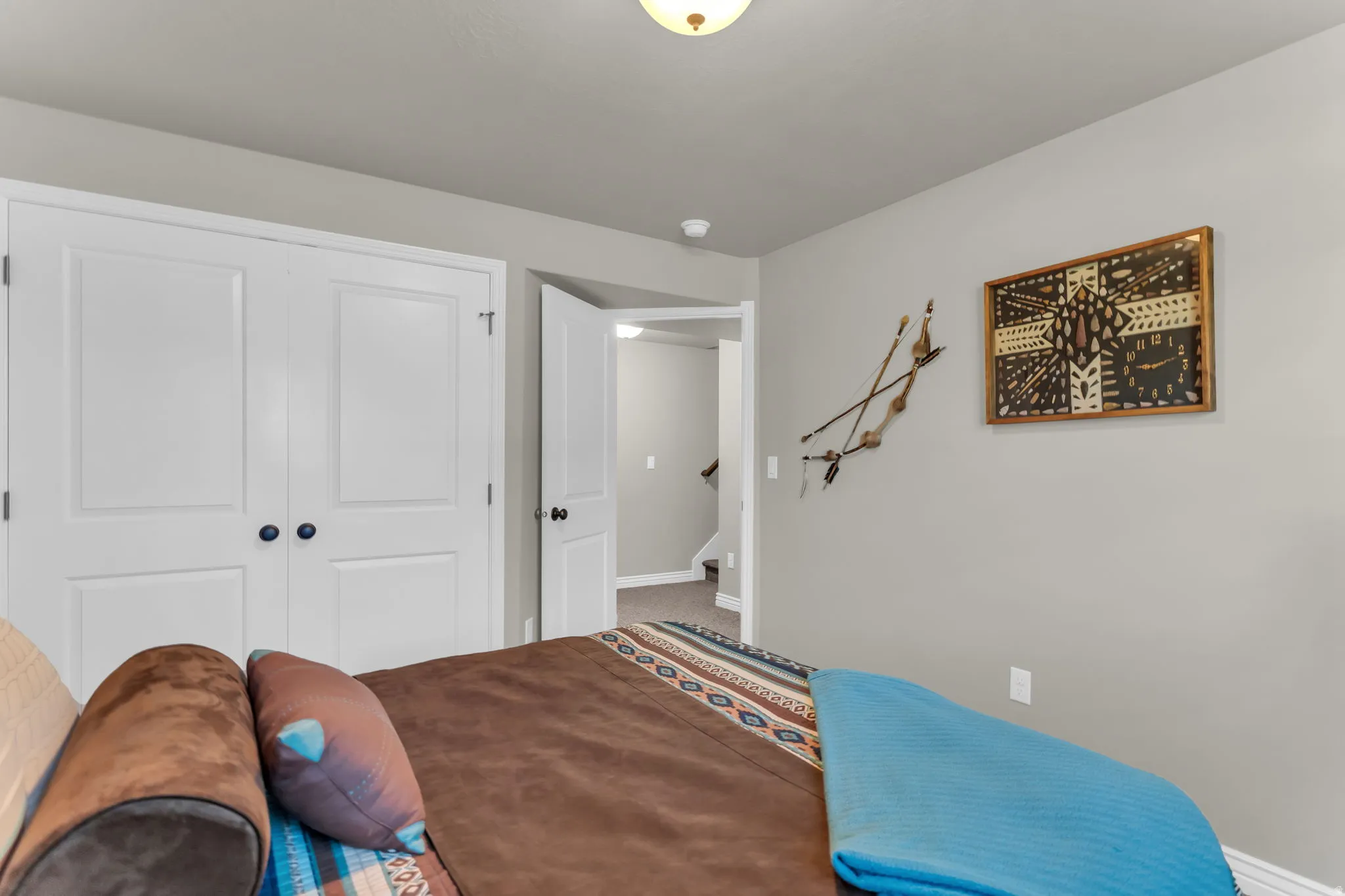Recessed lighting with a built-in closet and a neutral color palette