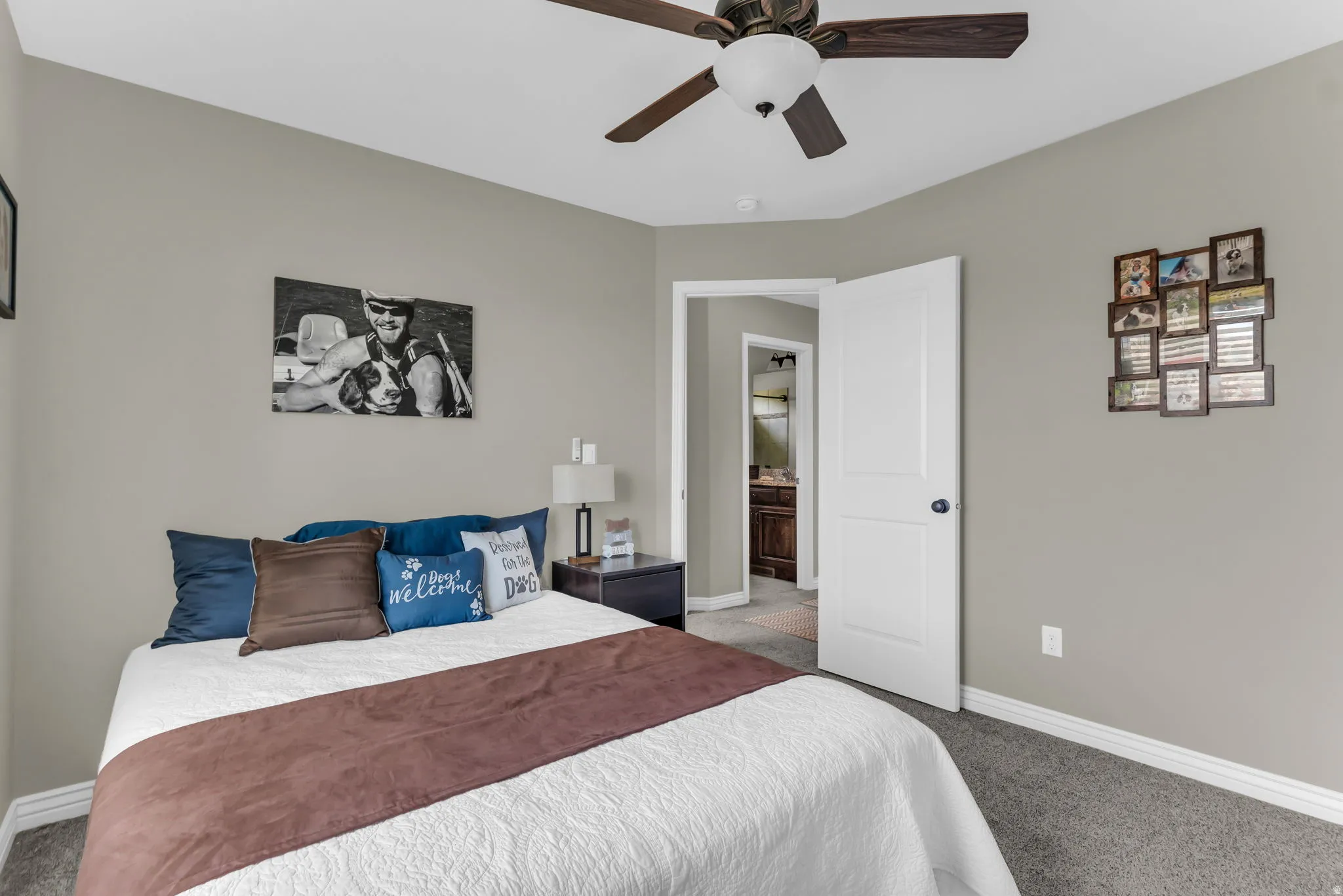 Recessed lighting, wood-finish ceiling fan, neutral wall paint, white trim, and gray carpeting
