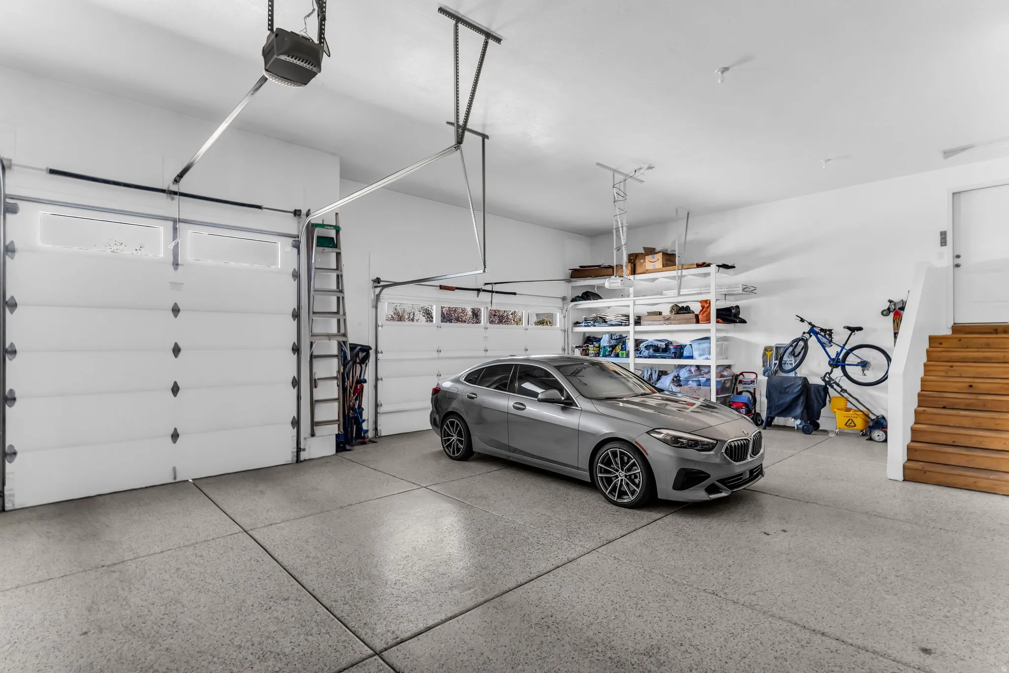 Two overhead garage doors with frosted window panels