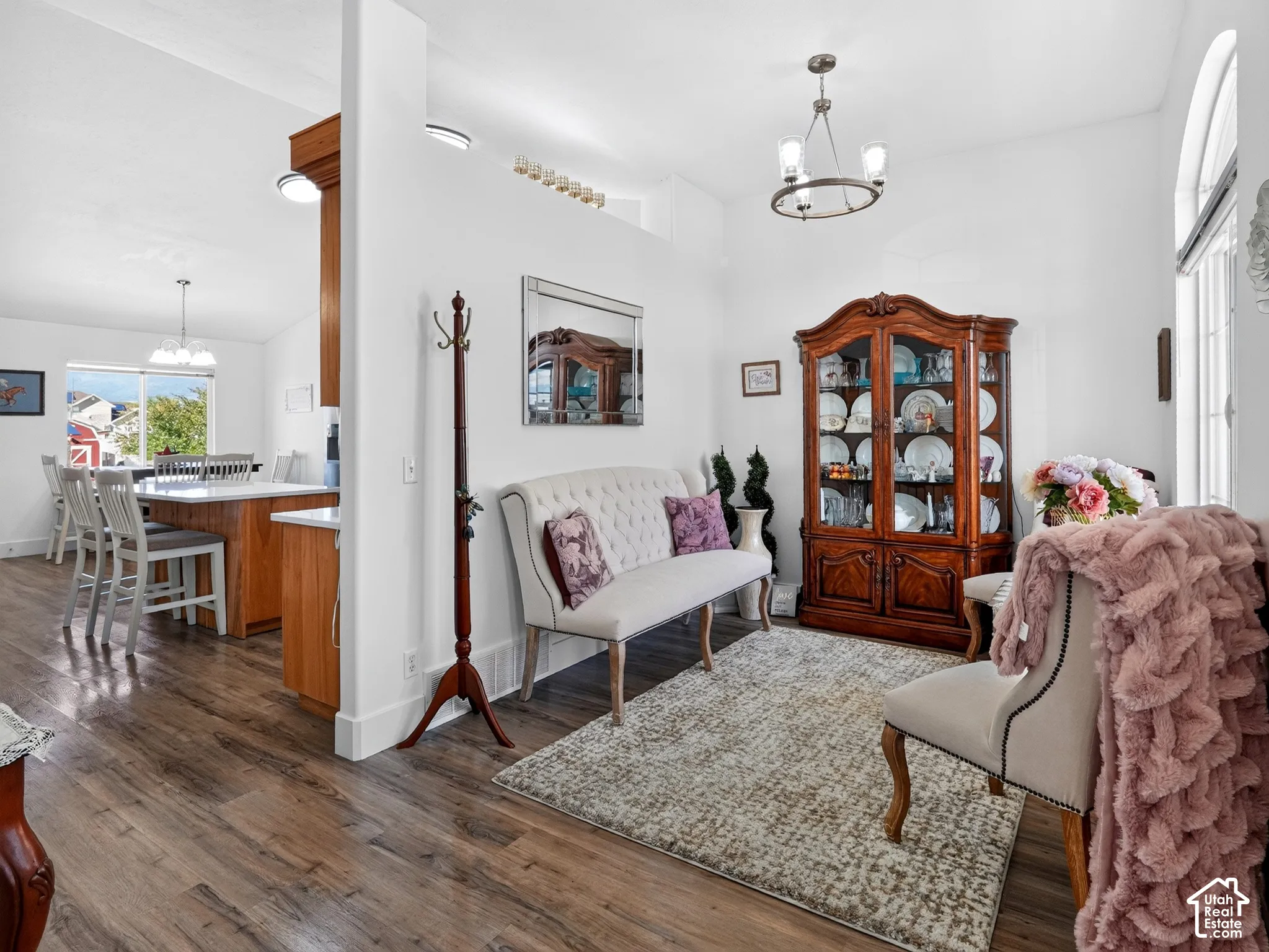Wood-finish flooring throughout, complemented by a white wall palette