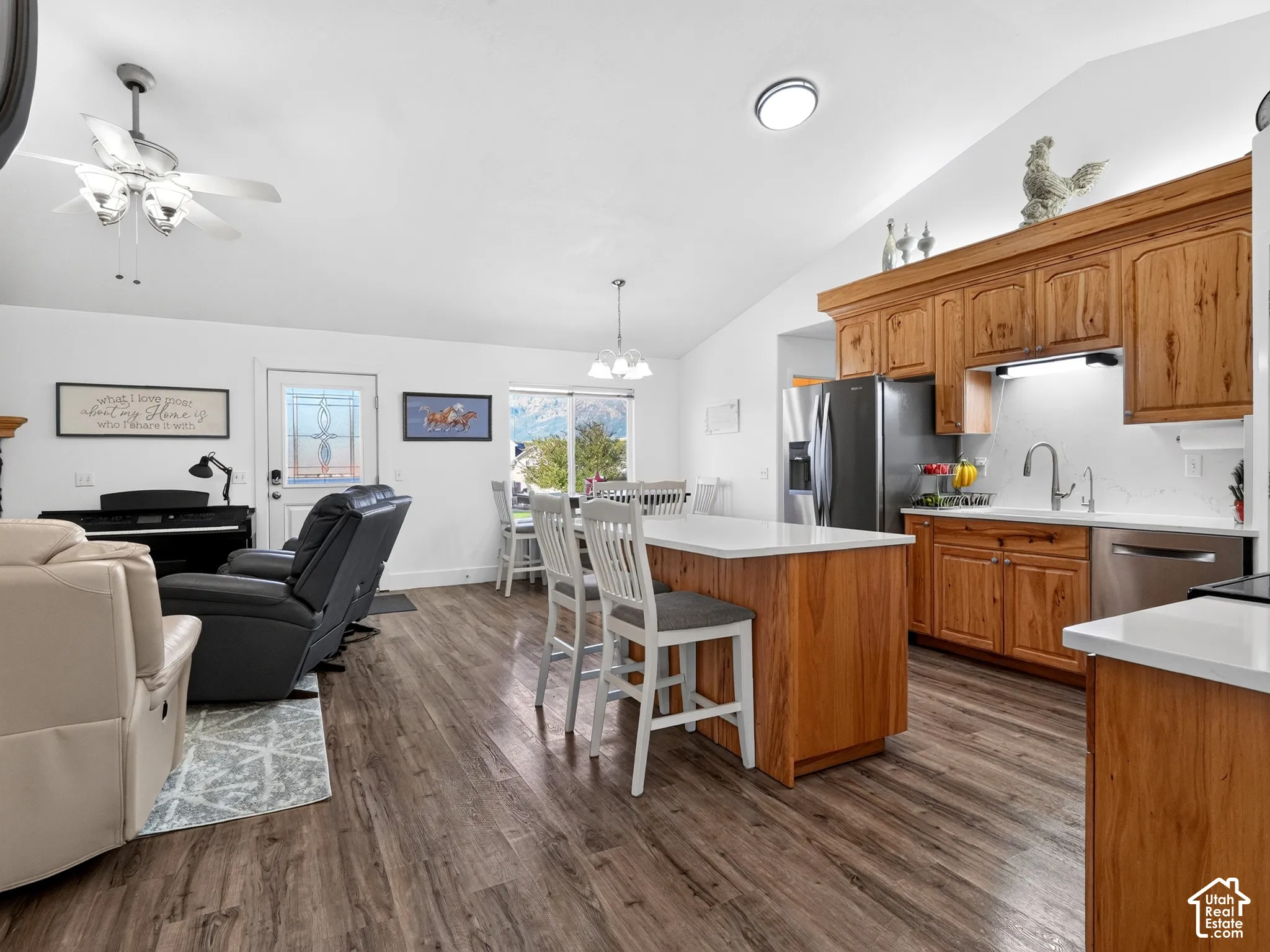 Kitchen featuring wood-finish cabinetry, stainless steel appliances, and white countertops
