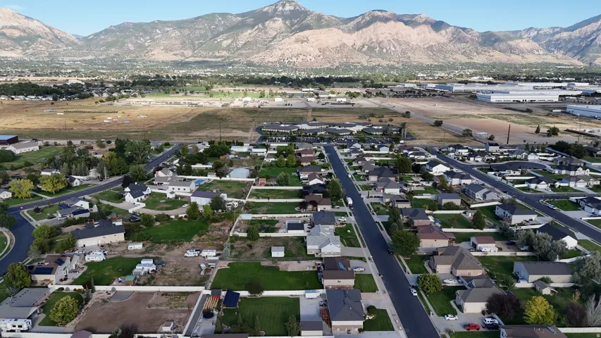Residential neighborhood with established streets and a mountainous backdrop