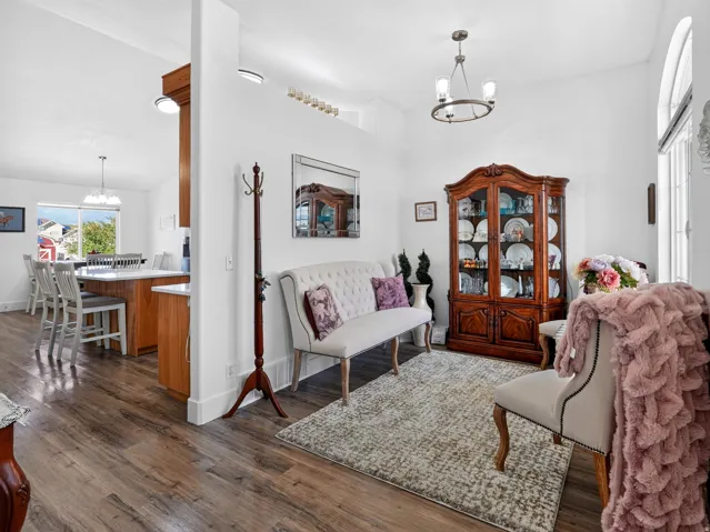 Wood-finish flooring throughout, complemented by a white wall palette