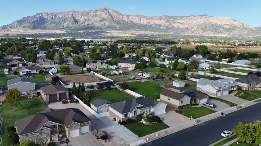 Mountain backdrop with residential properties and established landscaping