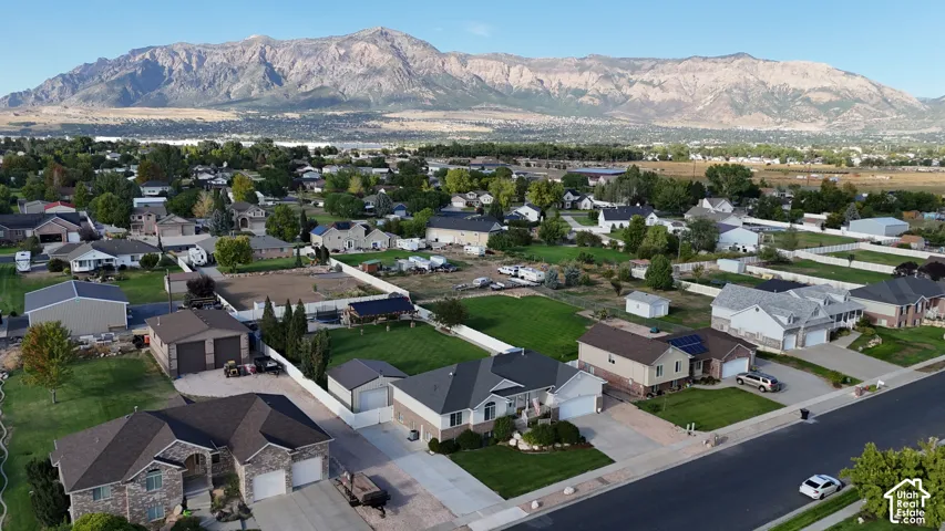 Mountain backdrop with residential properties and established landscaping