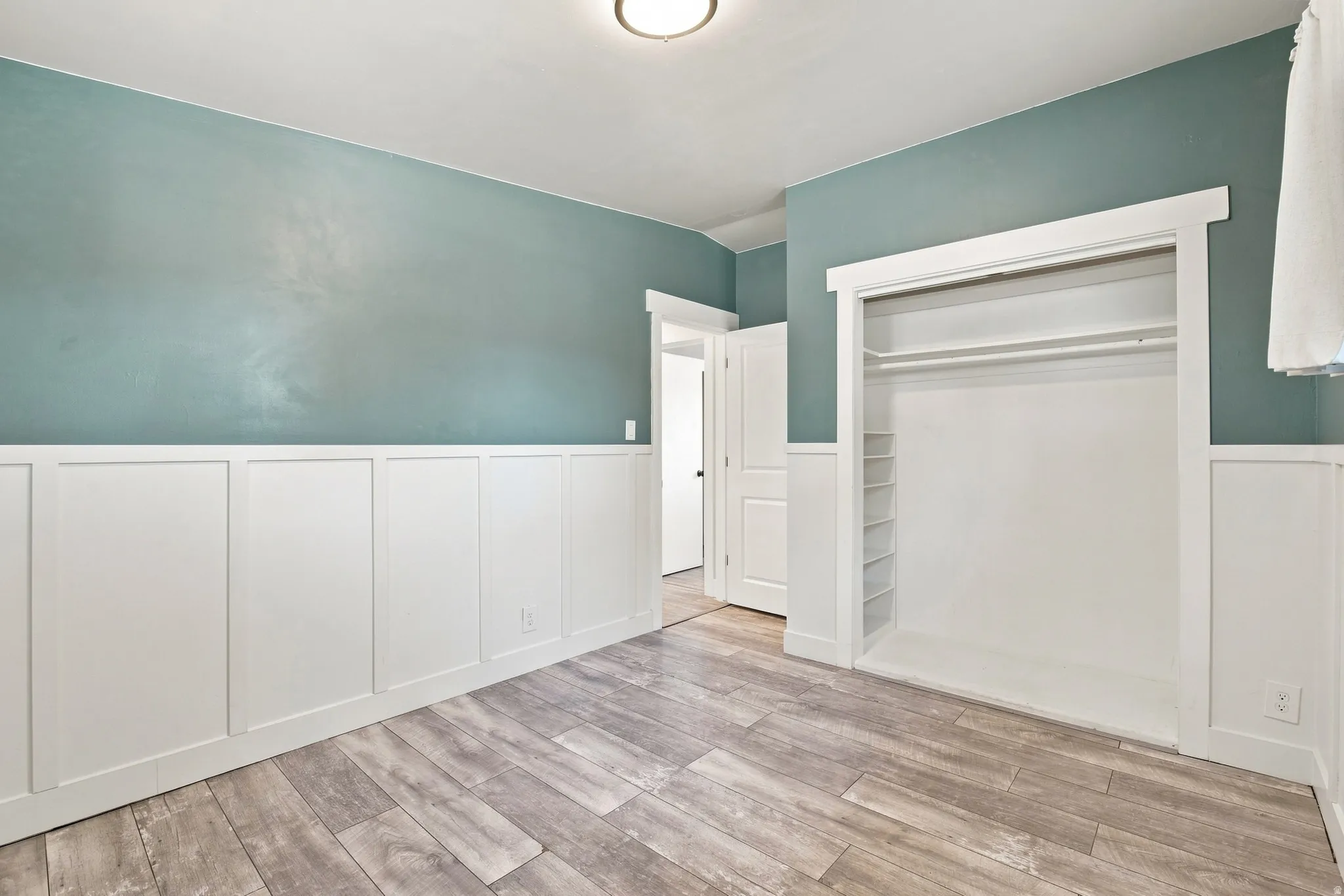 Wood-finish flooring with crisp white board and batten detailing
