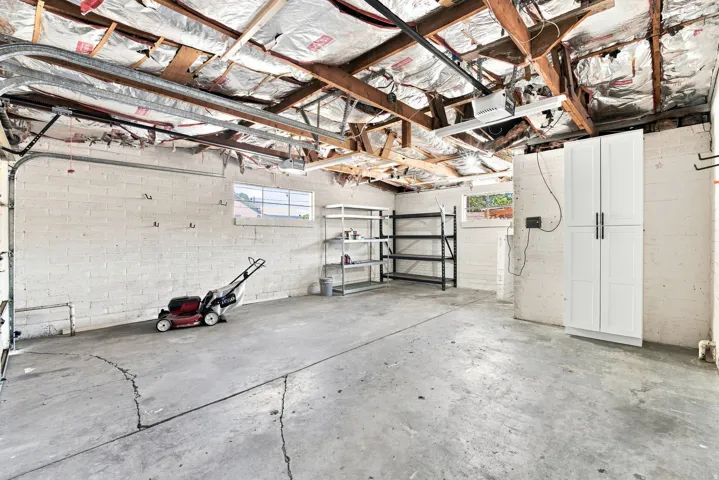 Concrete flooring with white painted block walls