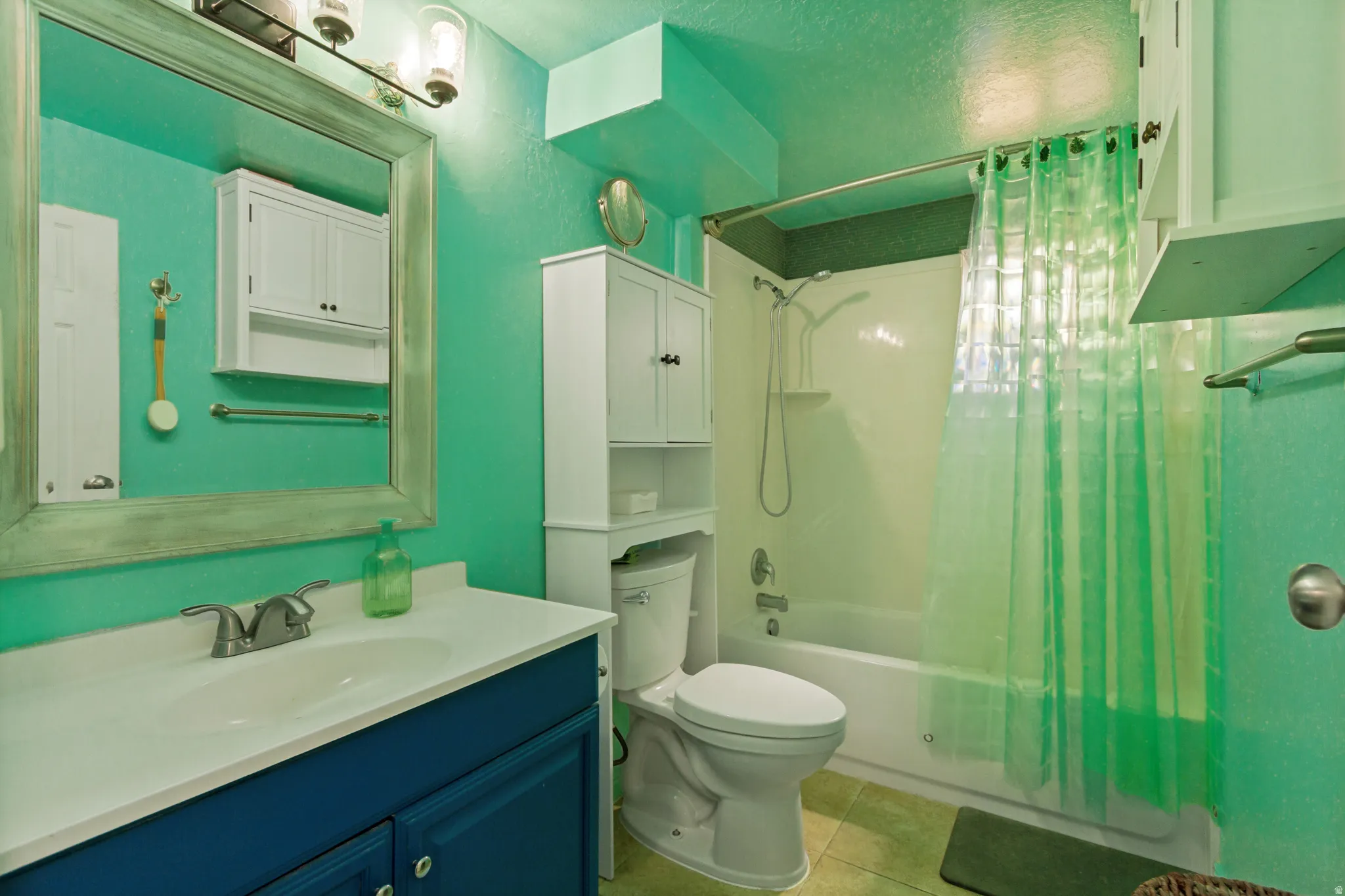 Built-in vanity with a white countertop and undermount sink