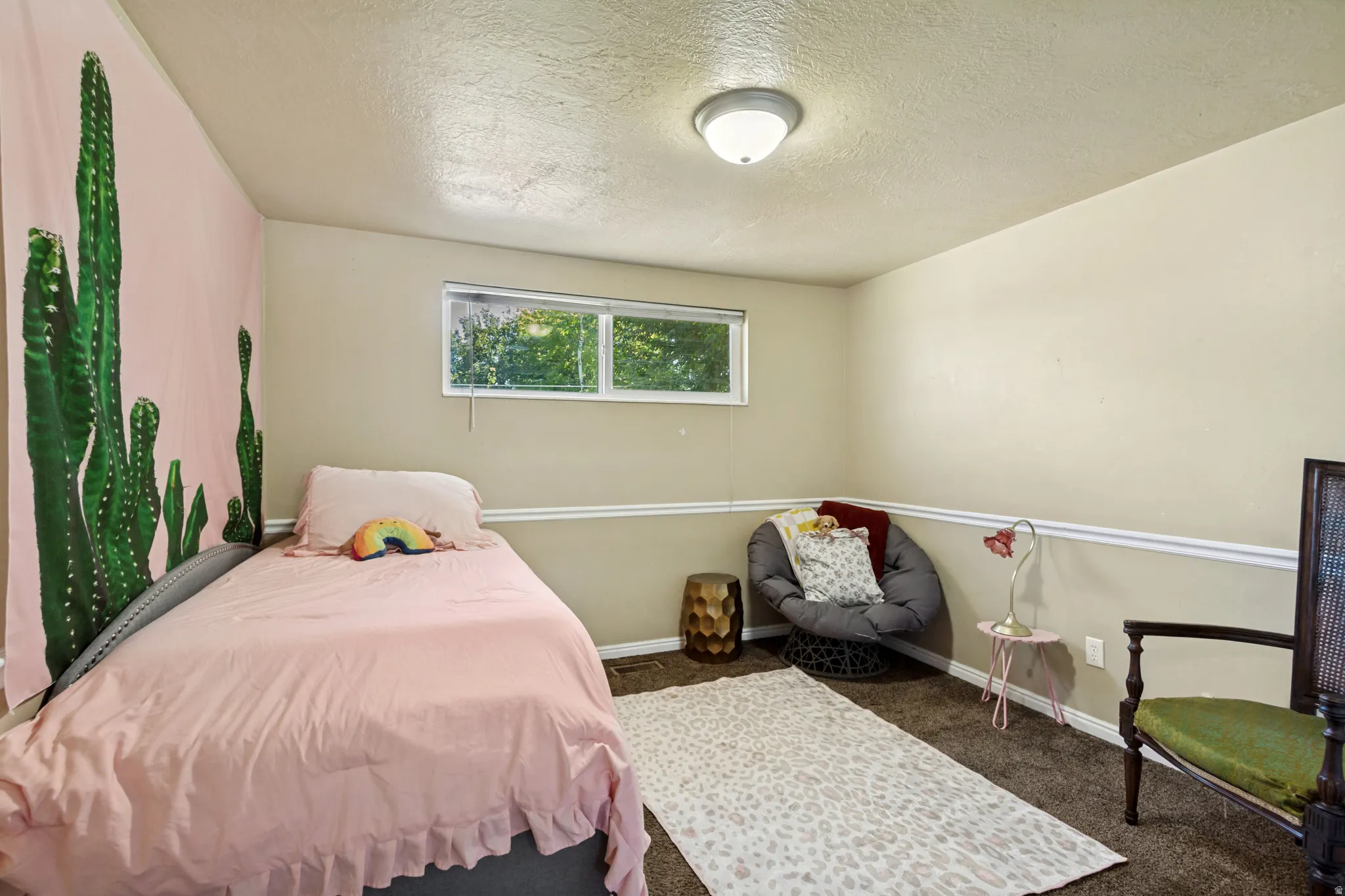 Room featuring wall-to-wall carpeting, a window with blinds, and a flush-mount ceiling light