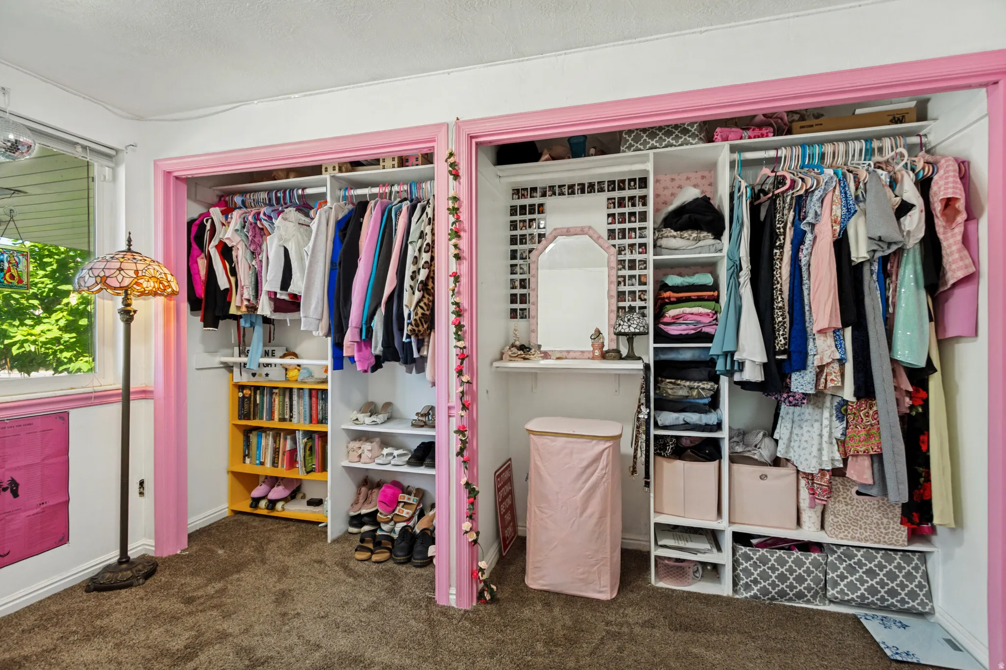 Built-in closet organization system with shelving and hanging rods