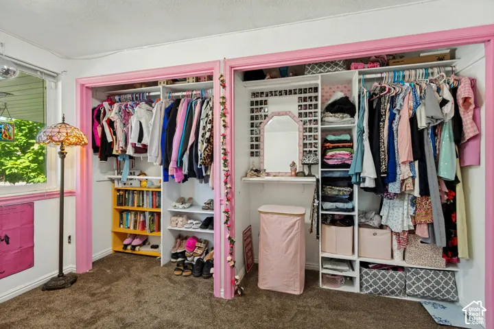 Built-in closet organization system with shelving and hanging rods