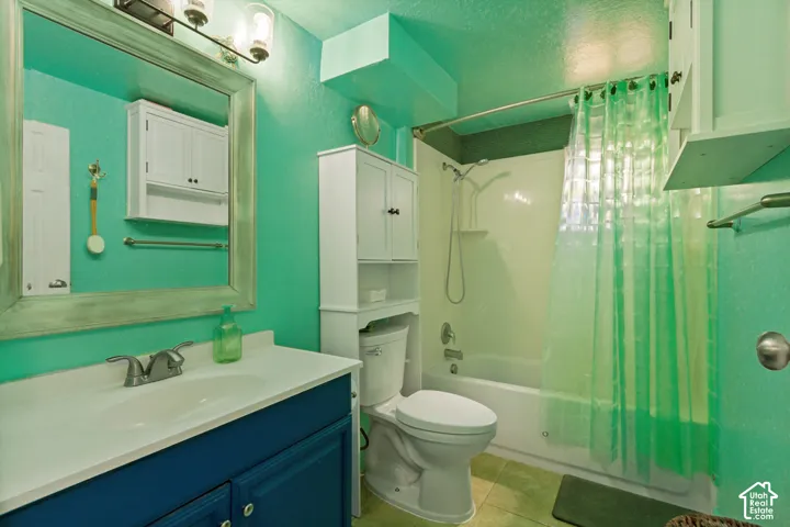Built-in vanity with a white countertop and undermount sink