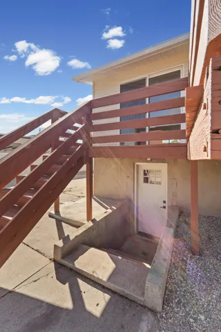 Wood-stained exterior staircase and deck railing