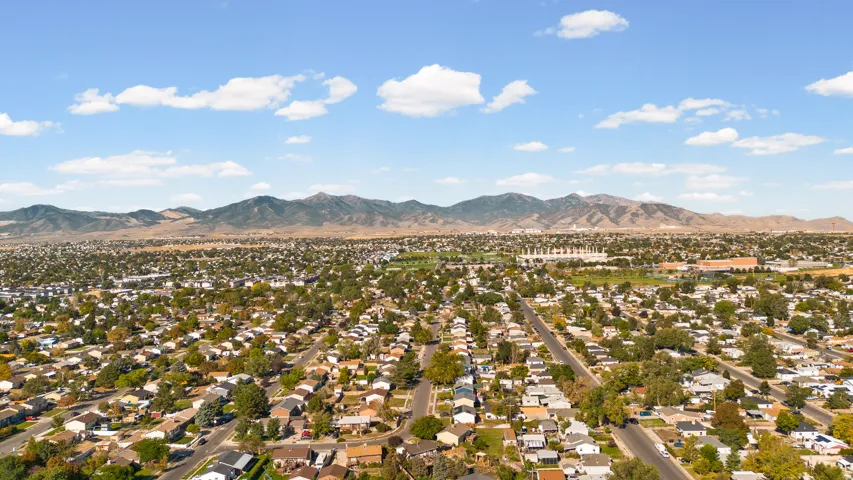 Expansive neighborhood setting with established residential properties and mature trees