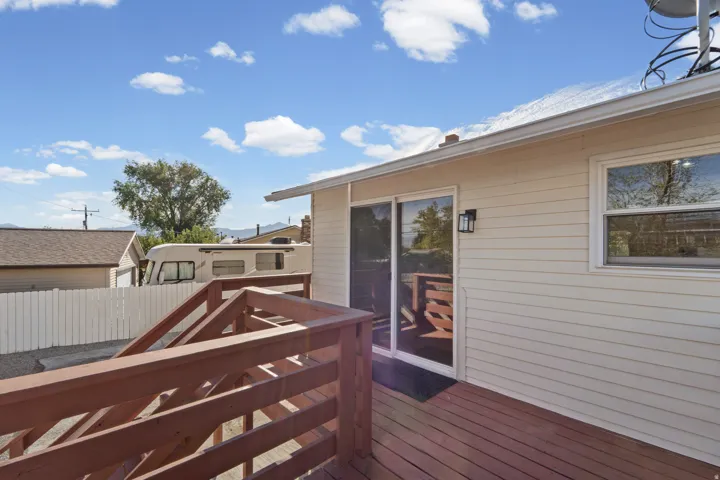 Wood-finish deck with slatted railings