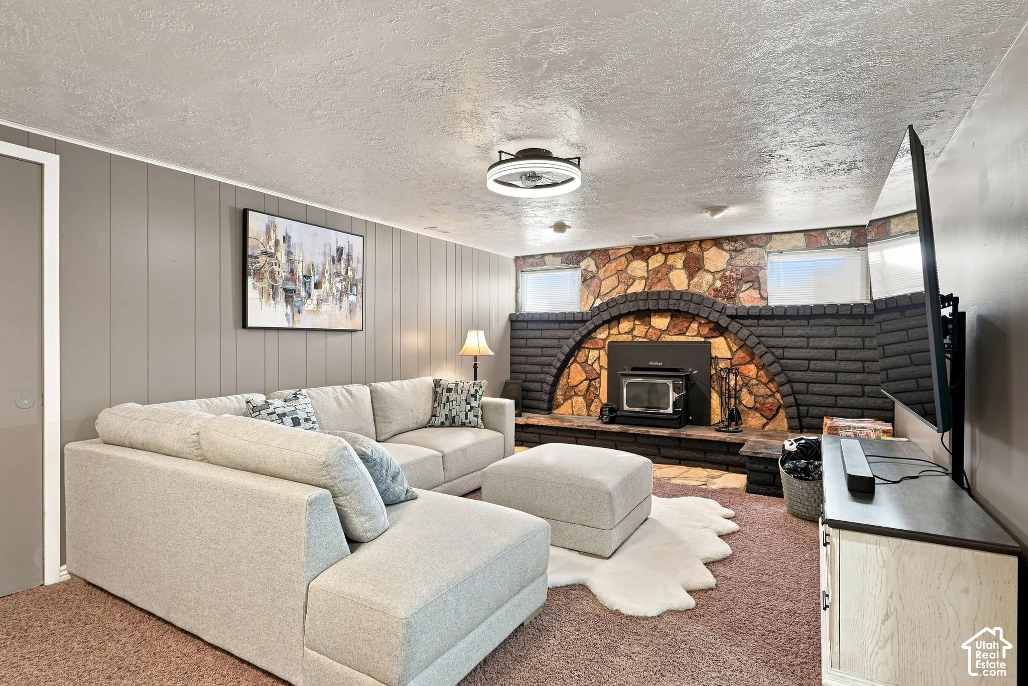 Living room, stone and brick fireplace (original) with wood burning stove