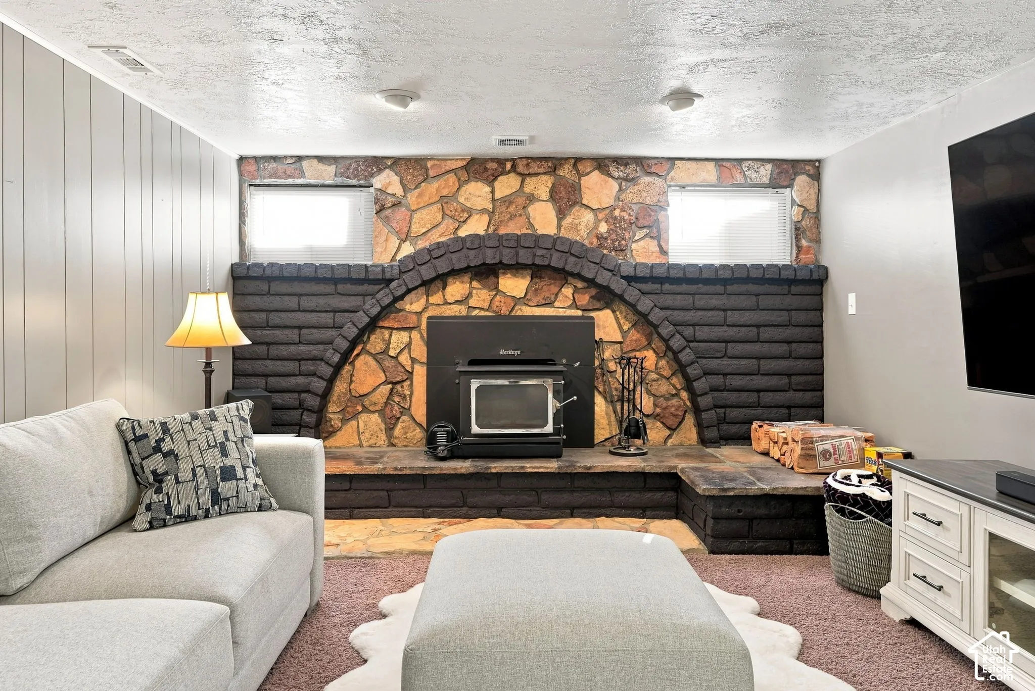 Stone and brick fireplace (original) with wood burning stove