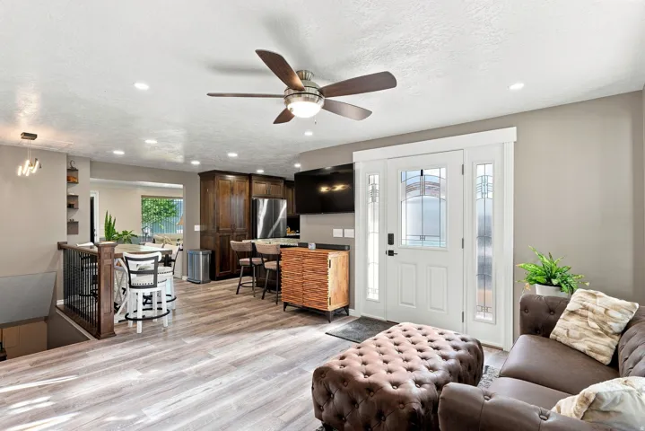Wood-finish flooring, recessed lighting, and a ceiling fan