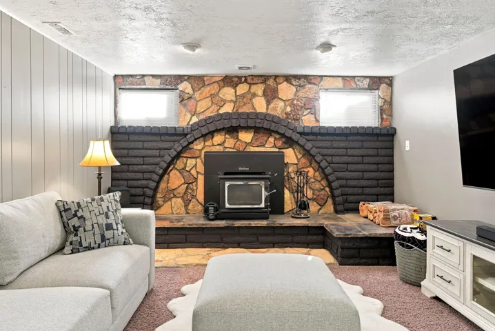 Stone and brick fireplace (original) with wood burning stove