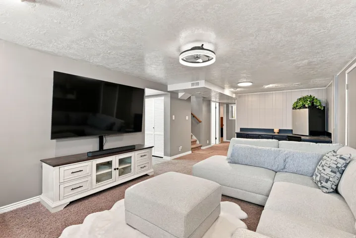 Recessed and semi-flush mount lighting fixtures illuminate the space
