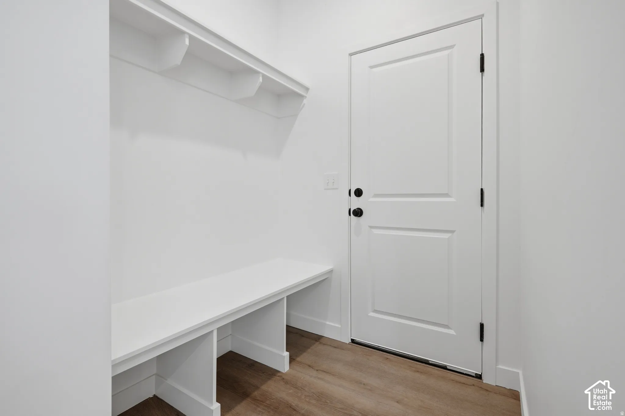 Built-in bench with cubby storage and shelving