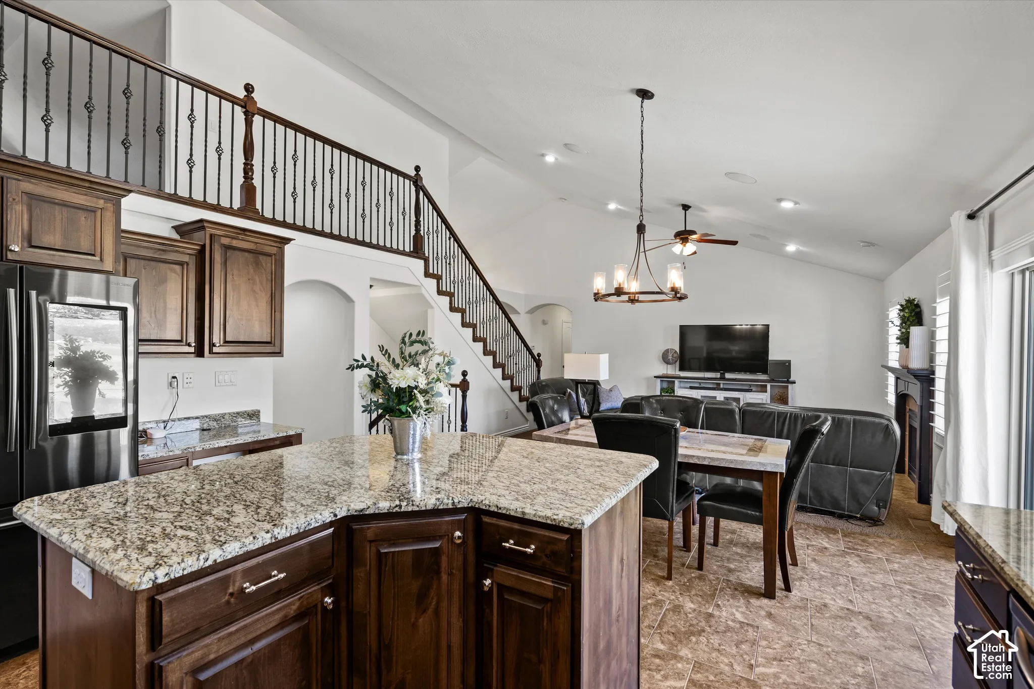 Kitchen with granite countertops and wood-finish cabinetry