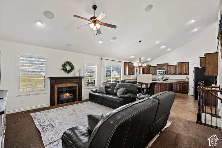 Vaulted ceiling featuring recessed lighting and a ceiling fan