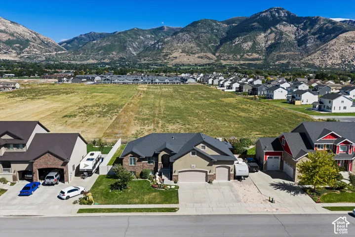 Mountainous backdrop with expansive open fields