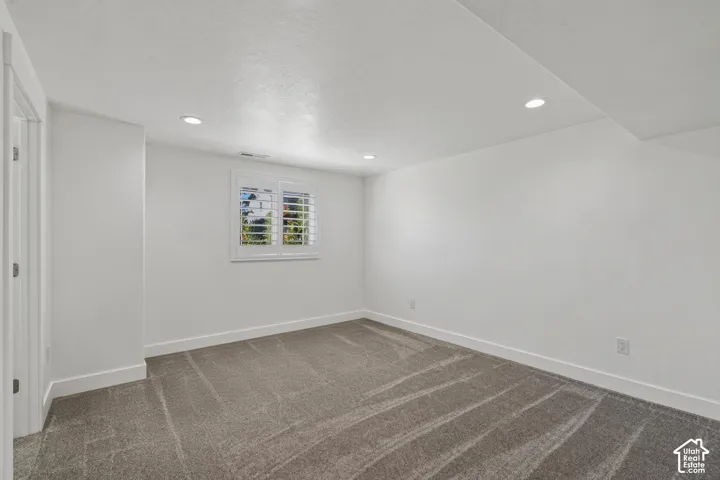 Recessed lighting illuminates a neutral color palette