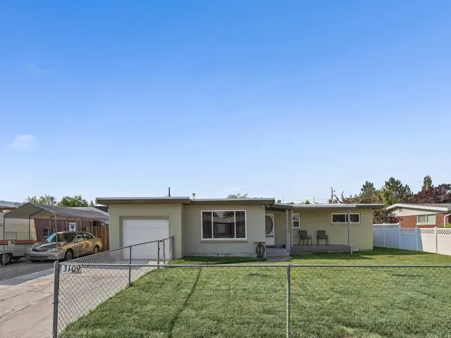 Single-story exterior with a light green finish