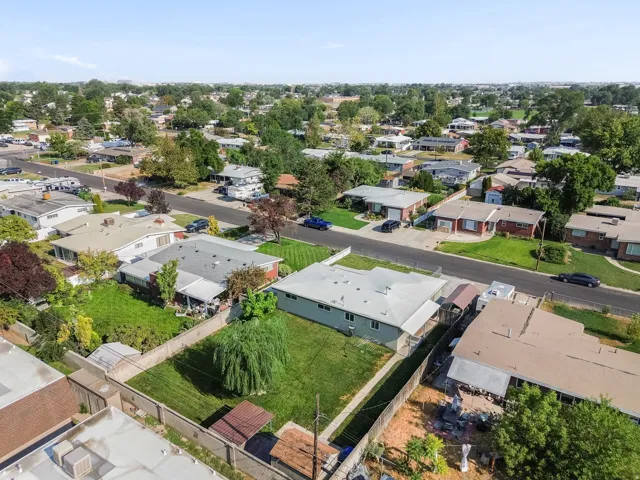 Expansive residential neighborhood with mature trees and paved streets