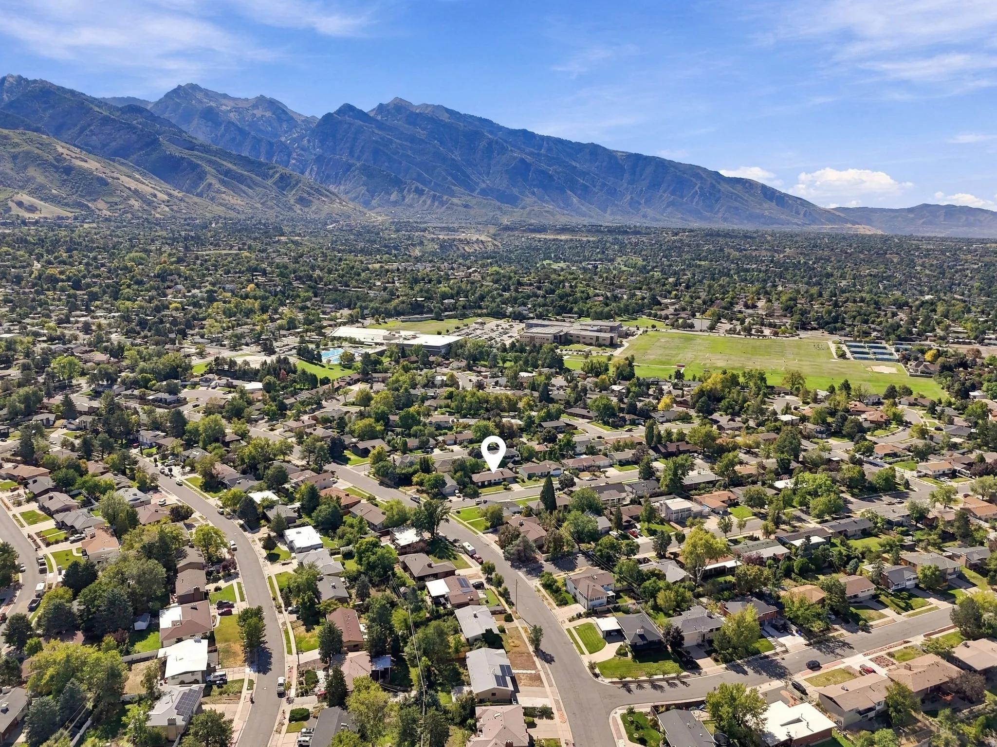 Expansive residential area with a prominent mountain range backdrop