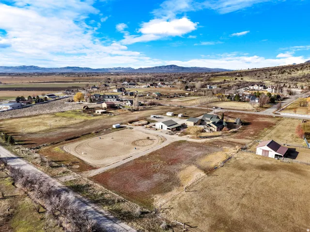 Expansive property featuring a riding arena, multiple outbuildings, and a detached barn