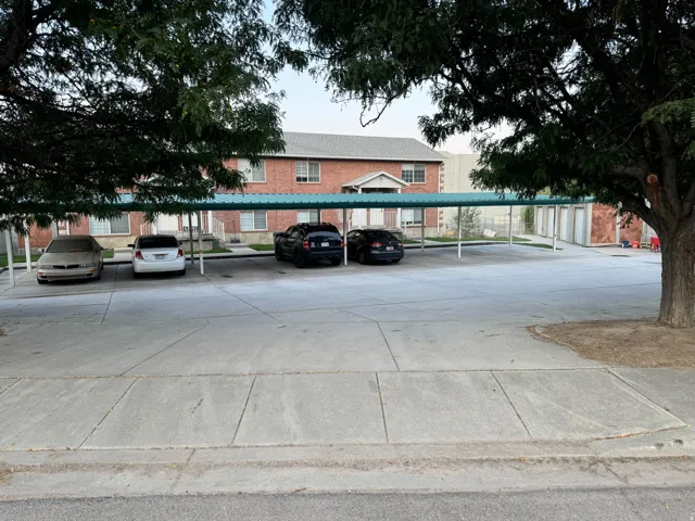 Carport parking with an asphalt shingle roof building