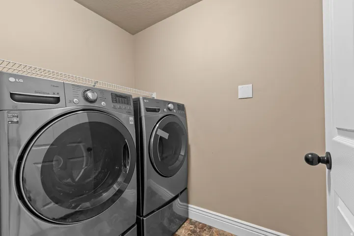 Laundry area with wire shelving and durable flooring