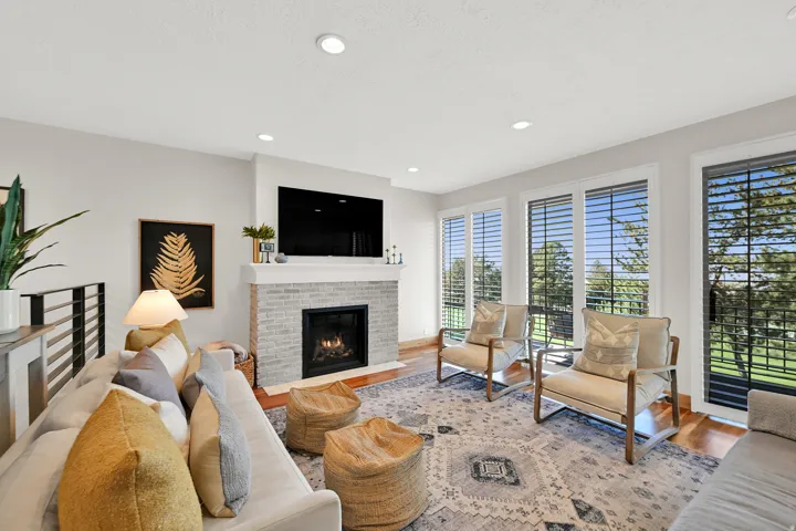 Gas fireplace with a light-colored brick surround and mantel