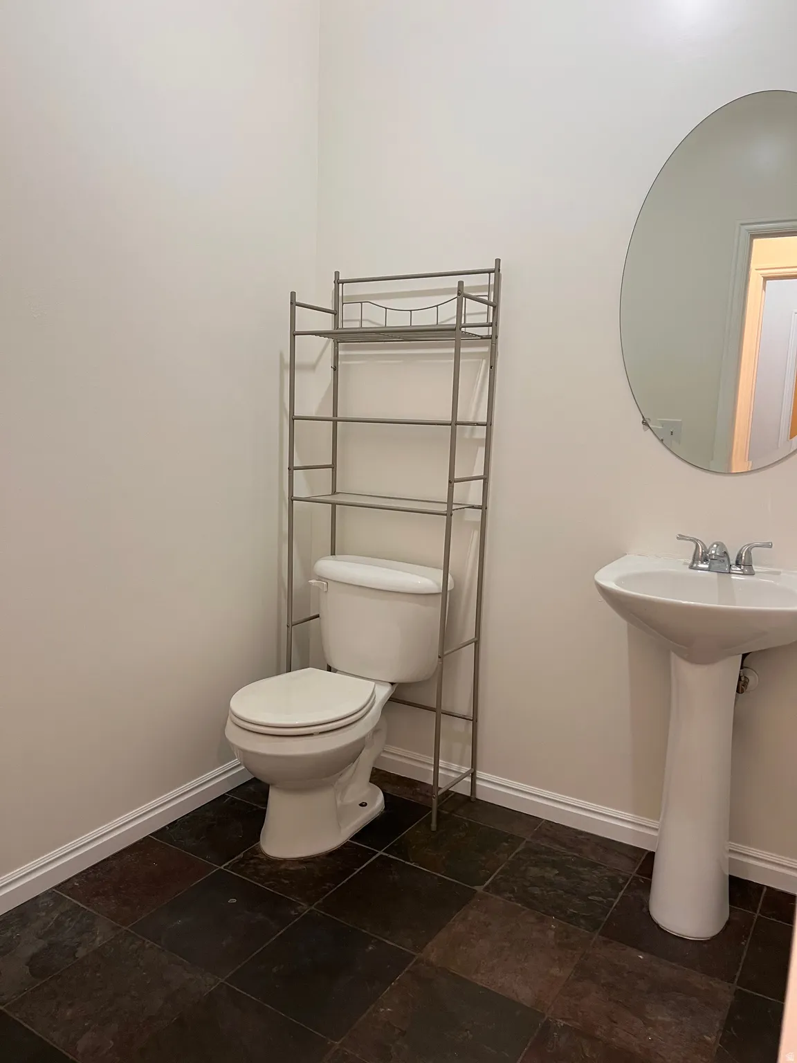 Half bathroom across from Laundry
