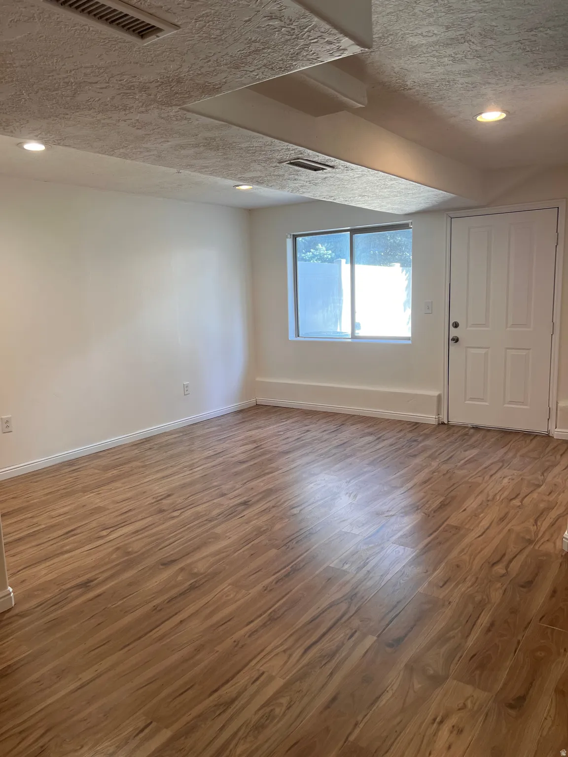 Spacious basement room, new flooring, new paint
