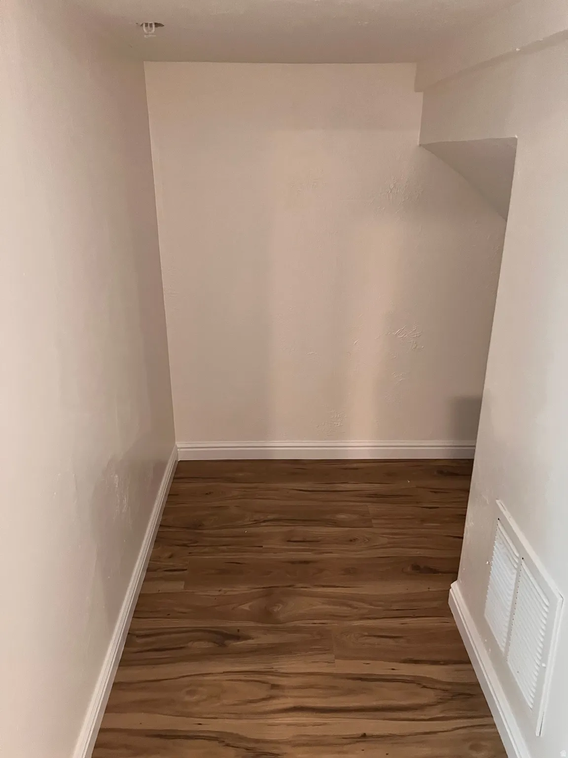 Storage under stairs, new flooring, new paint
