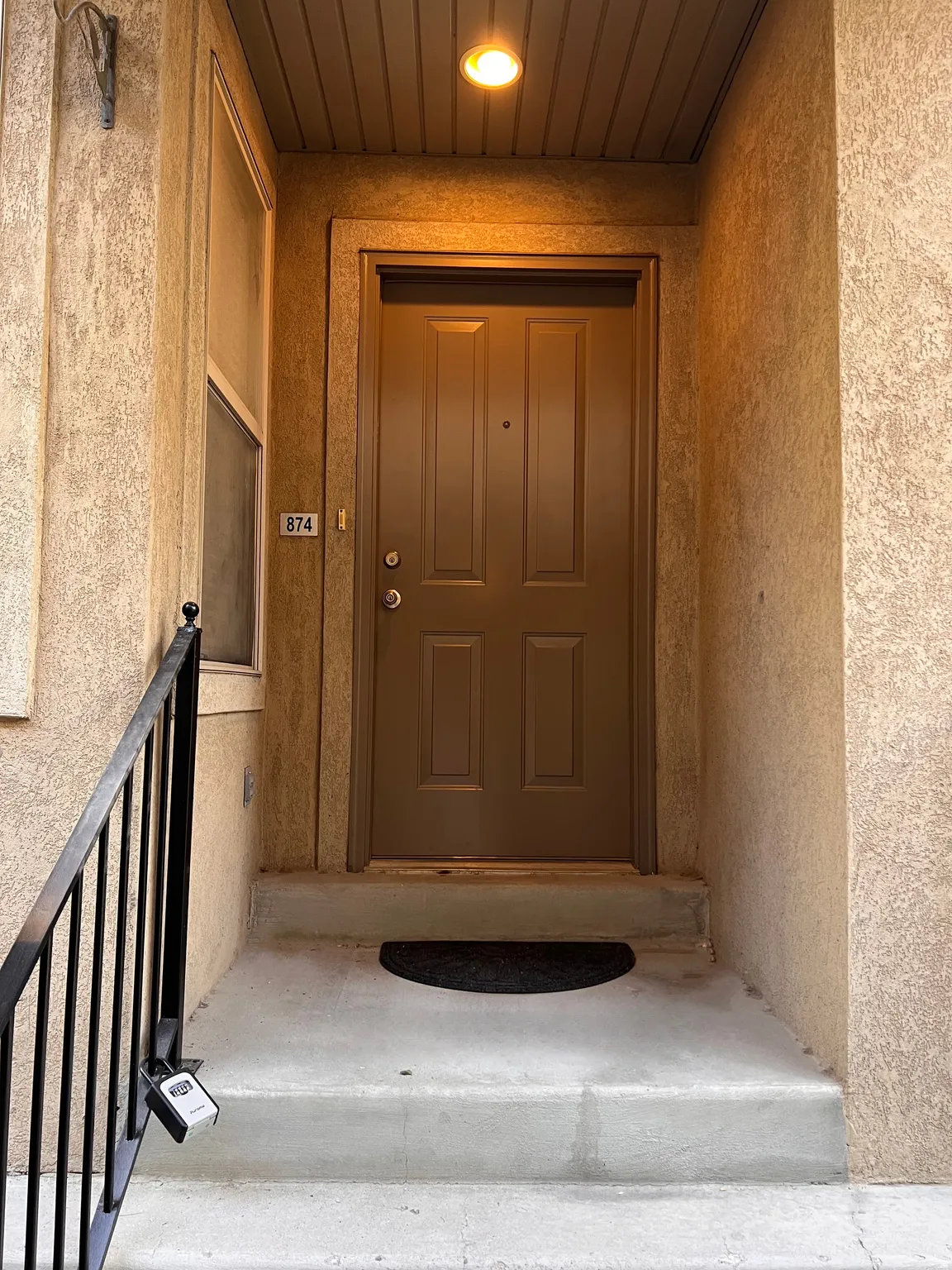Front door, newly painted door and railing