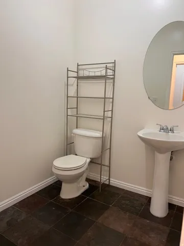 Half bathroom across from Laundry