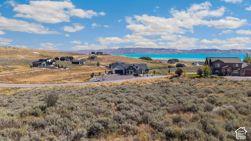 Expansive land parcel featuring open terrain and distant water