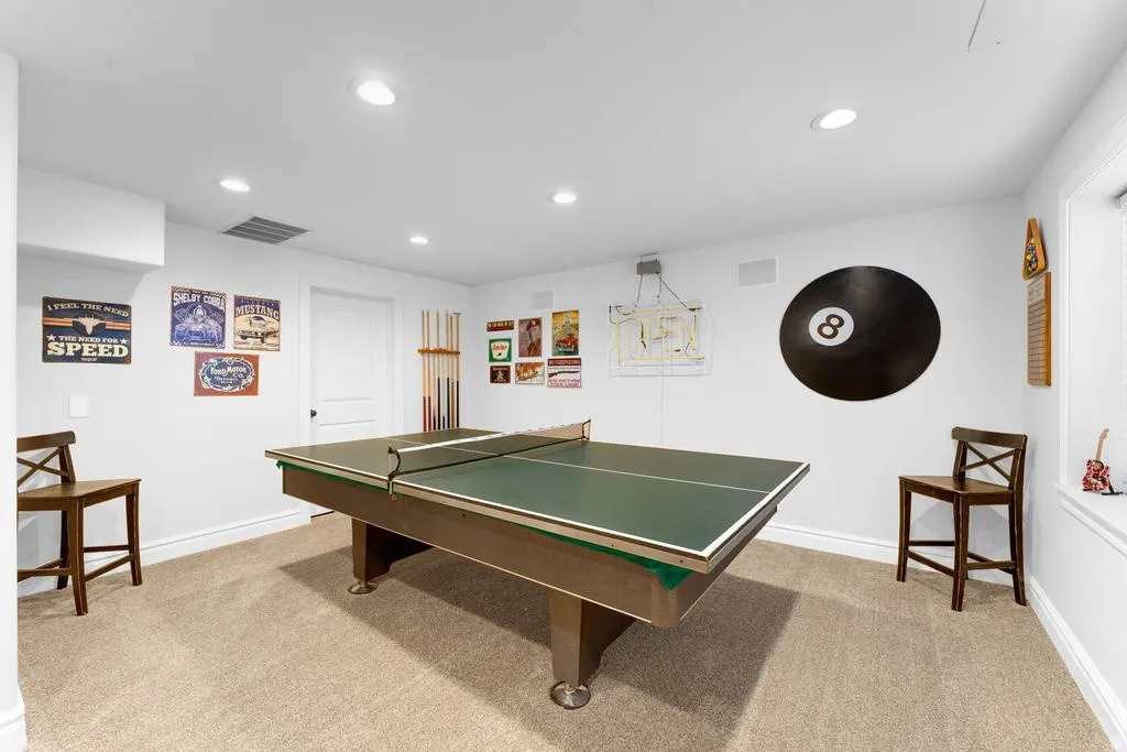 Carpeted recreation room with recessed lighting