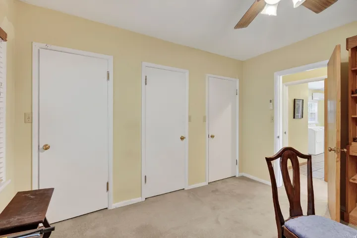 Recessed lighting, ceiling fan, and light-colored walls