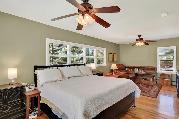 Hardwood flooring complemented by a rich green wall color