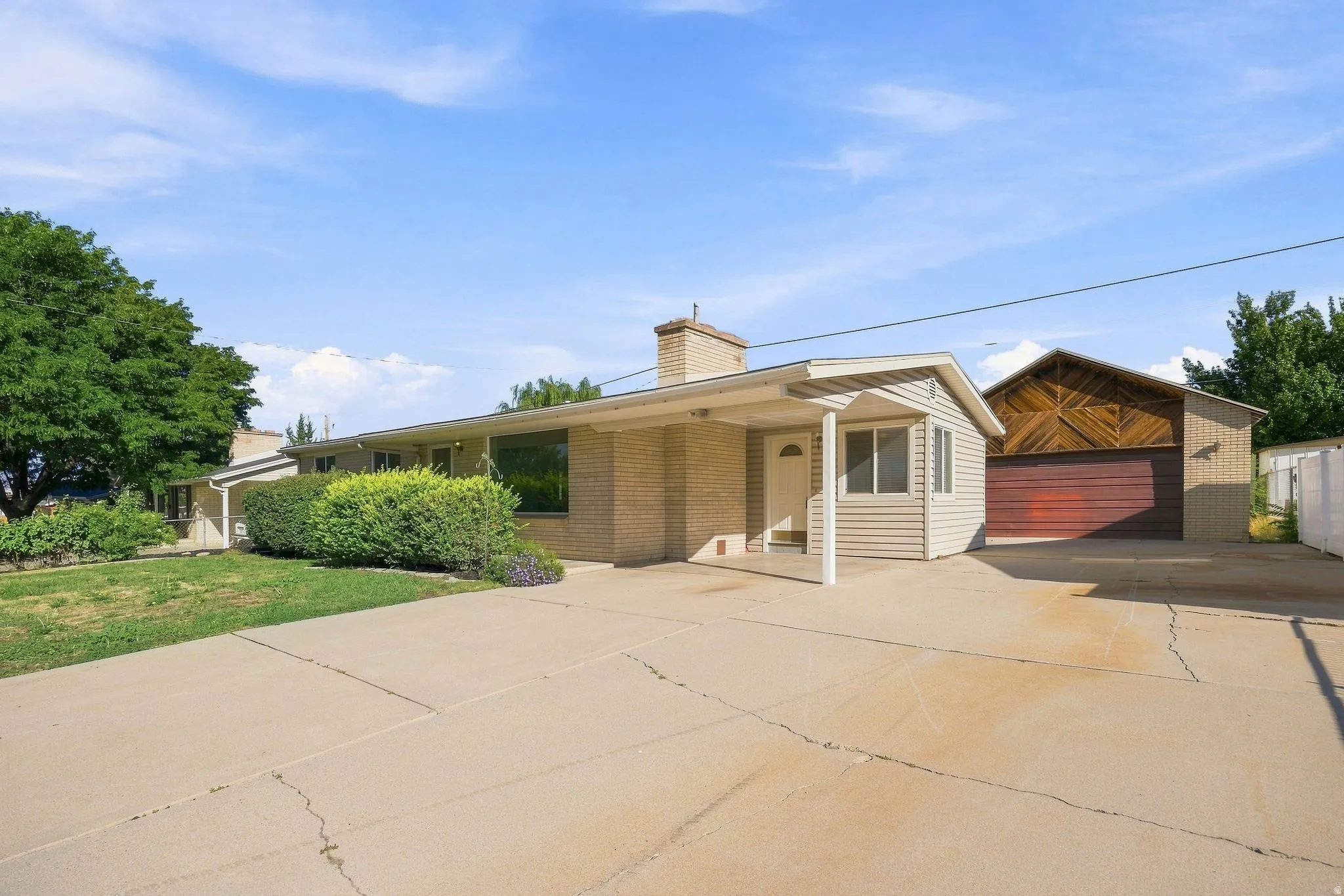 Brick exterior with covered entry and exceptional off-street parking.