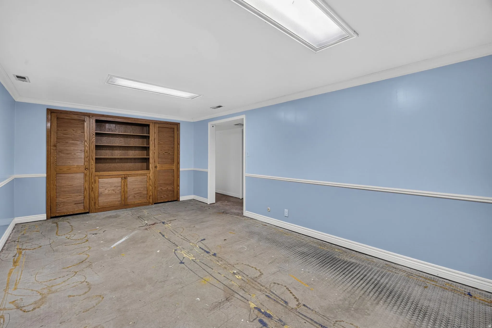 Hand crafted built-in wood cabinetry with shelving and concealed storage