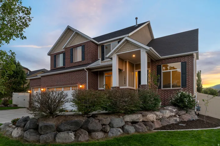 Brick exterior with gabled roof lines and dark shingles