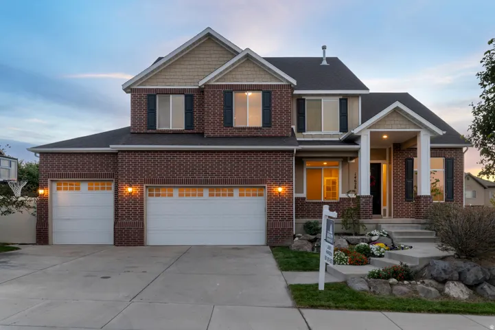 Brick veneer exterior with gabled roof lines and decorative front shutters